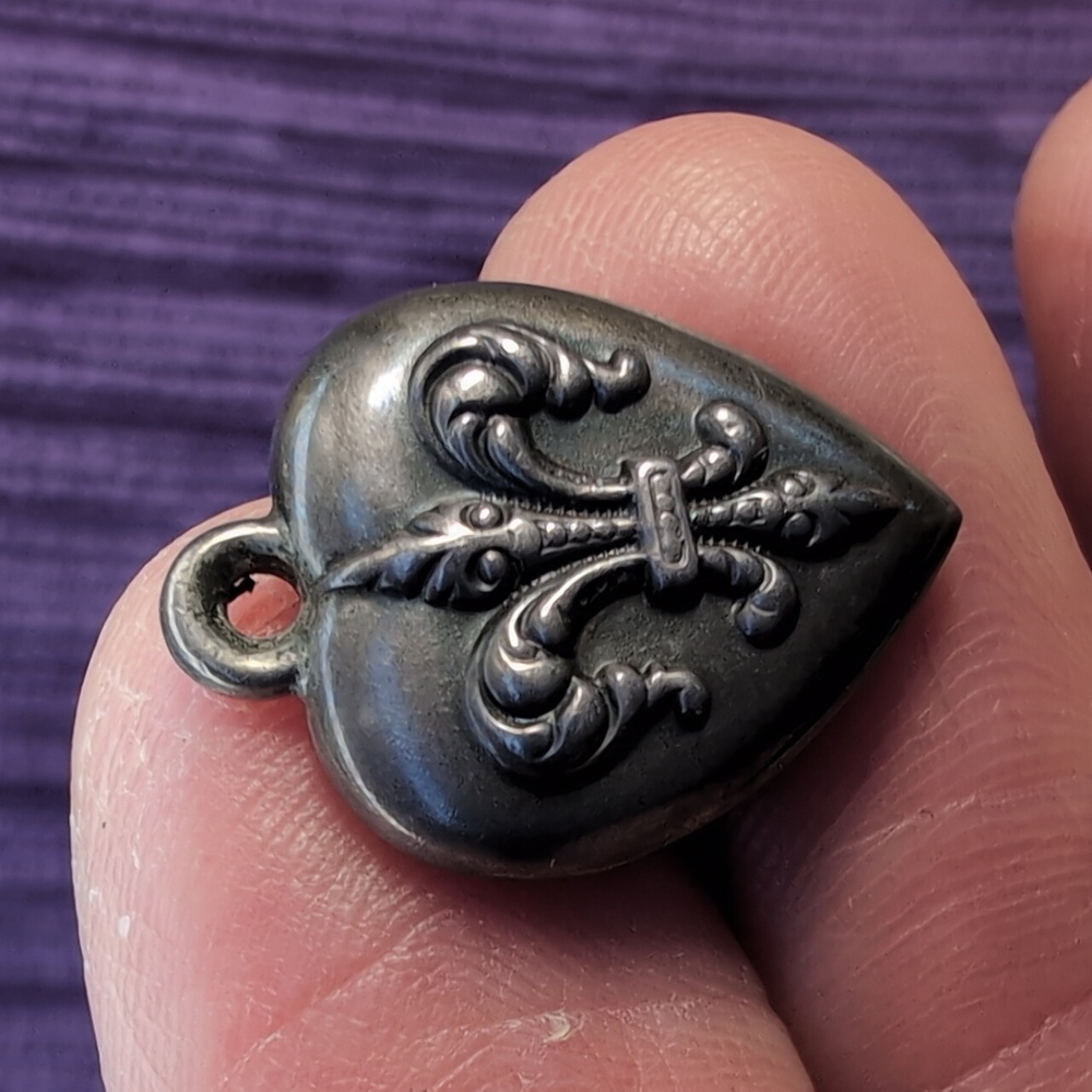 Antique sterling silver puffed heart charm